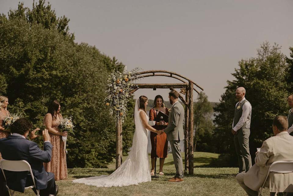 Bride and groom at outdoor altar