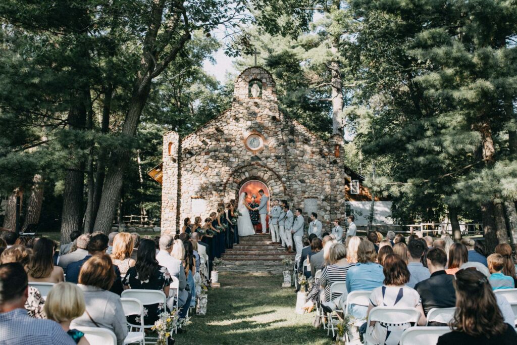 Ceremony outside stone chapel