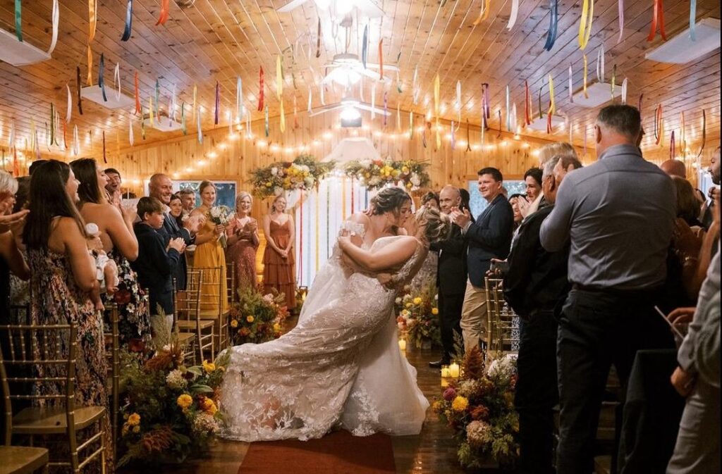 Couple embracing in rustic dinning hall