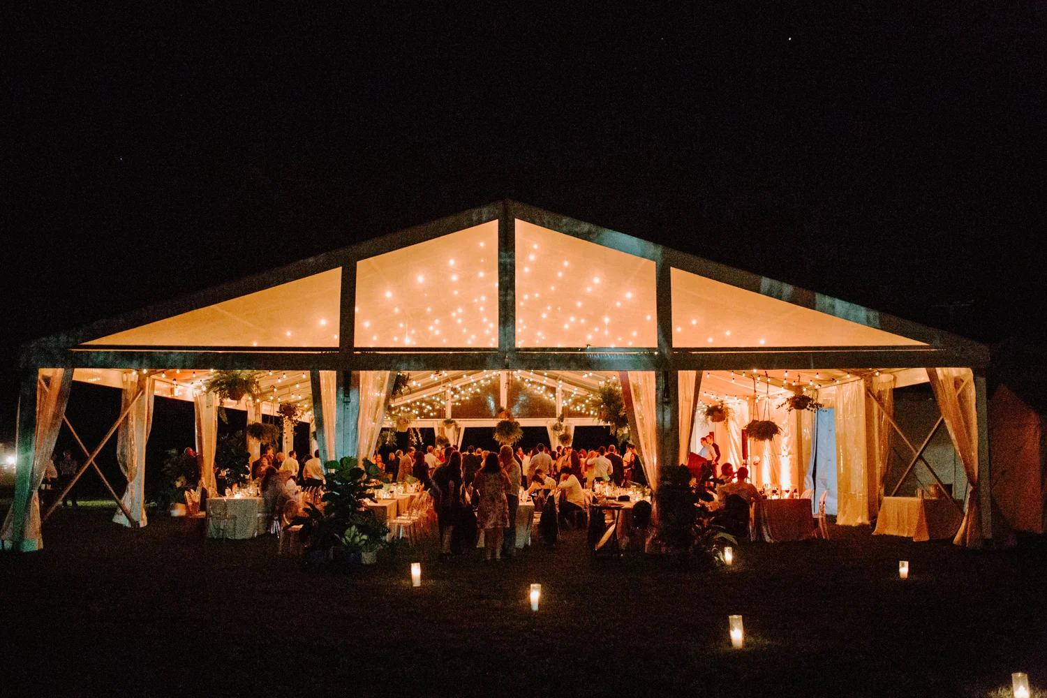 Outdoor night reception under tent