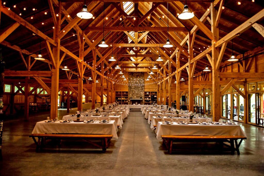 Reception setup in high-ceiling rustic dinning hall