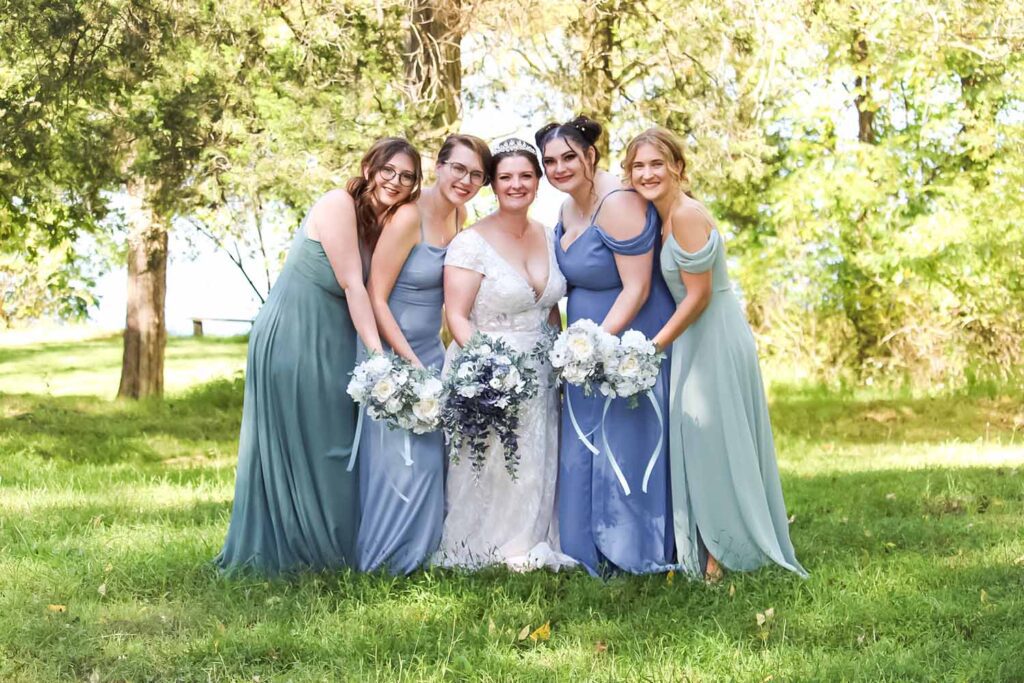 Bridesmaids with bride outdoors