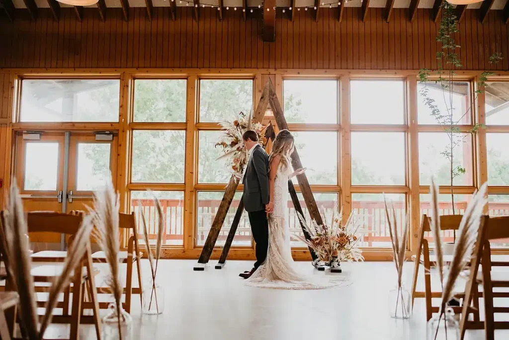 Bride and groom in rustic dinning hall