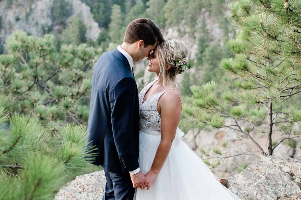Couple embracing on mountain cliff