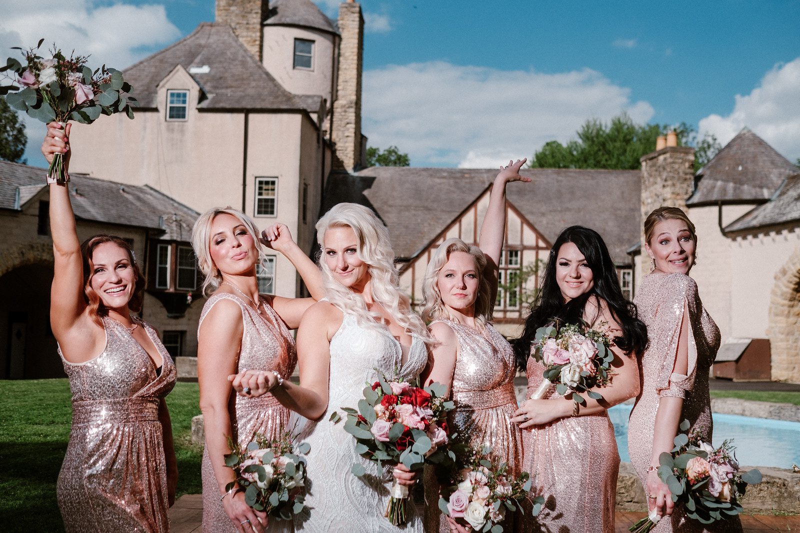 Bride and bridesmaids in front of a castle