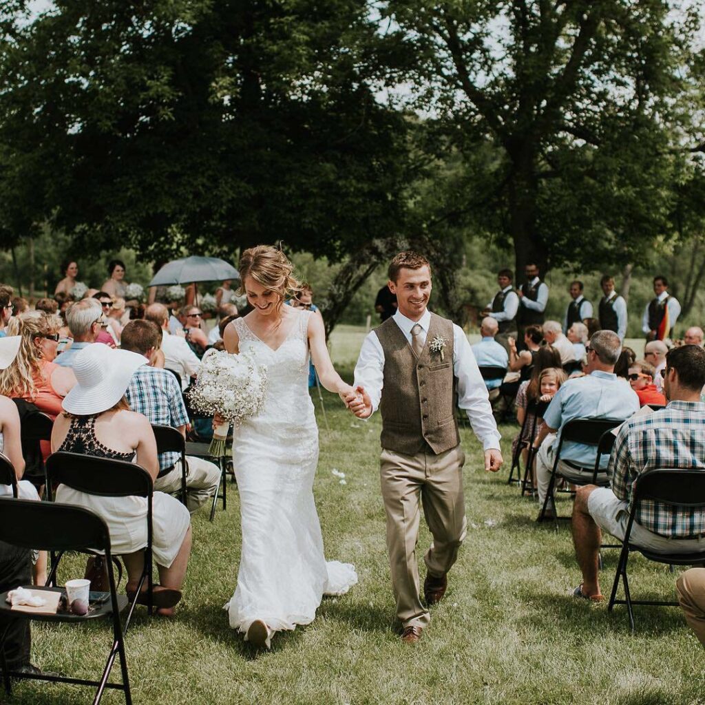 Bride and groom walking down aisle