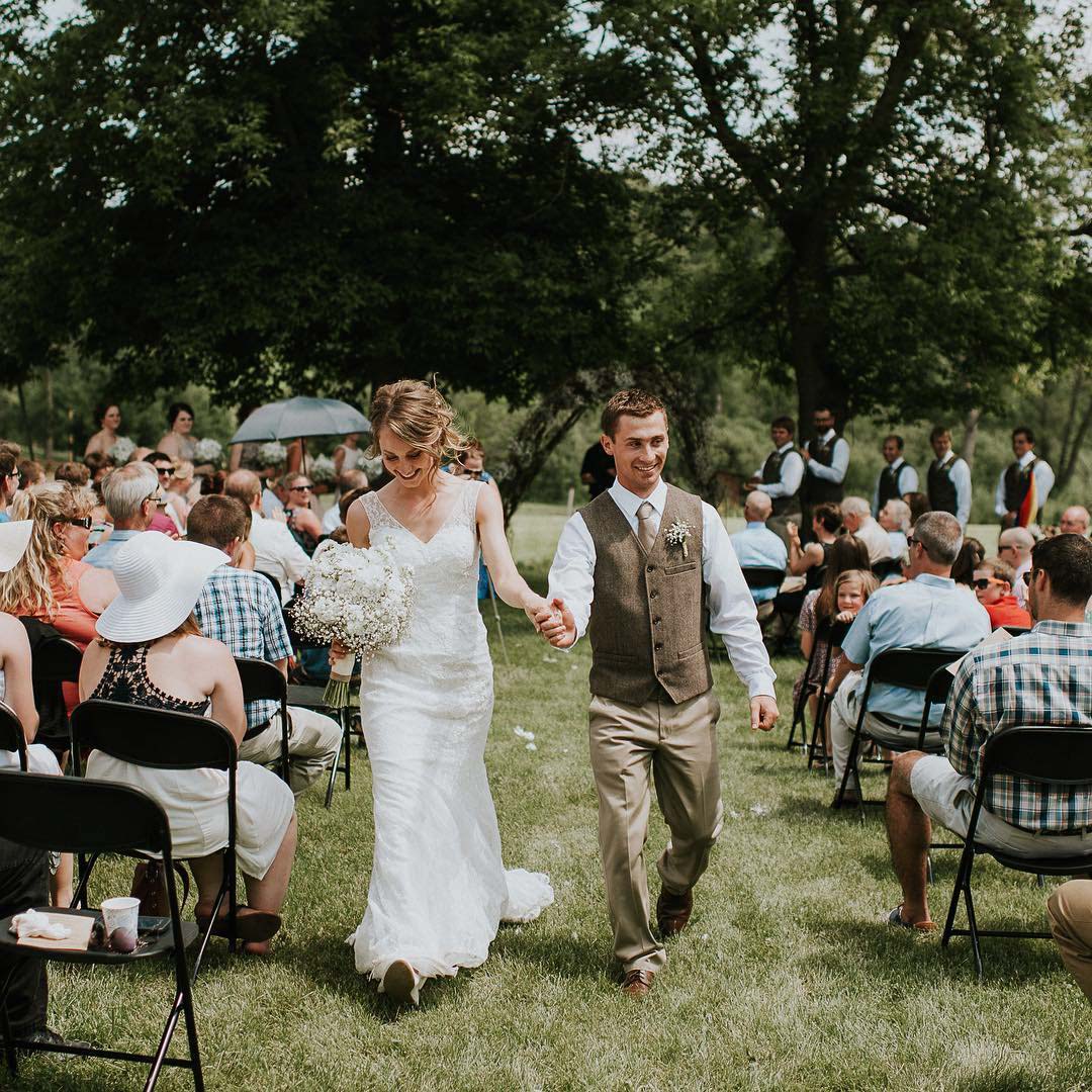 Bride and groom walking down aisle