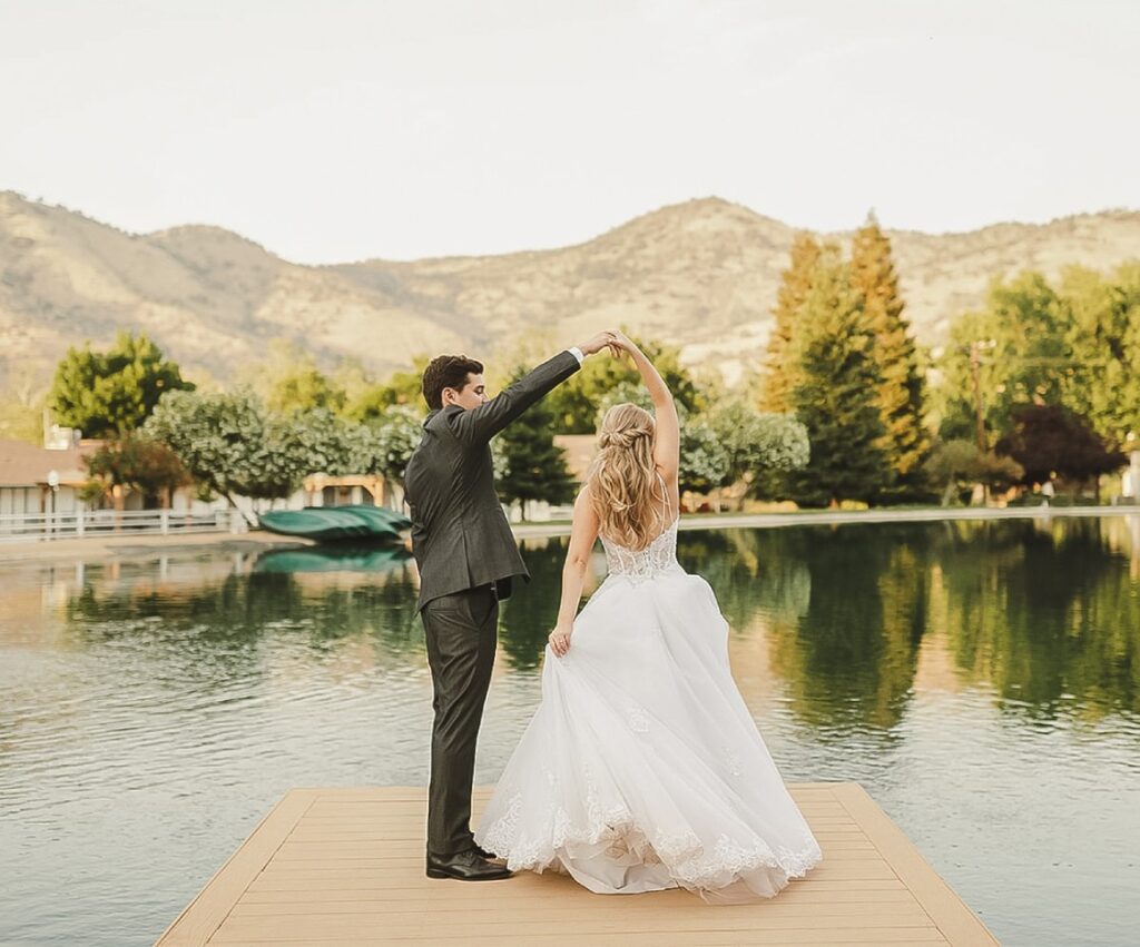 Bride and groom on dock at Wonder Valley