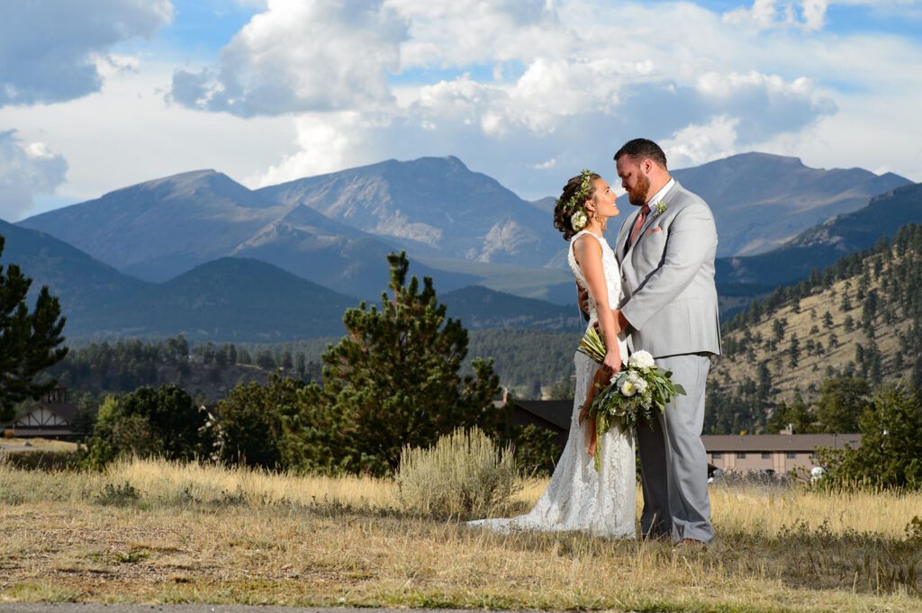 Bride and groom with mountains behind them